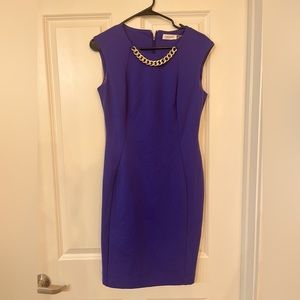 Calvin Klein purple sheath dress with gold collar detailing.